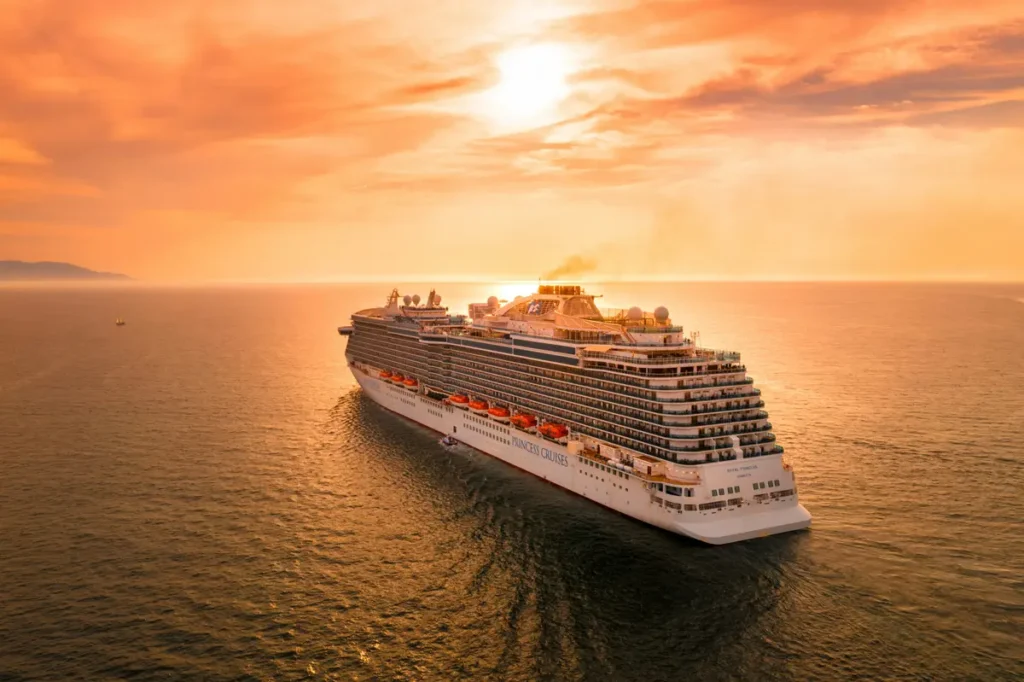 White cruise ship at sea during sunset