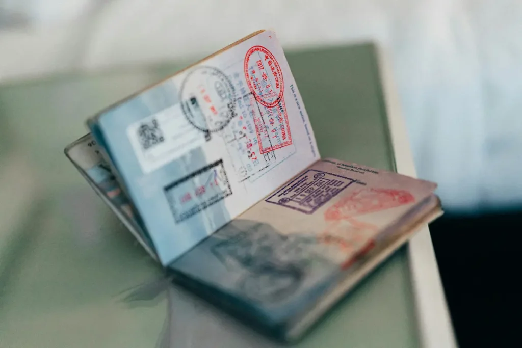 Open passport with multiple travel stamps