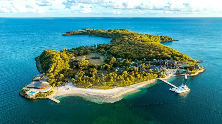 Green island resort surrounded by turquoise water