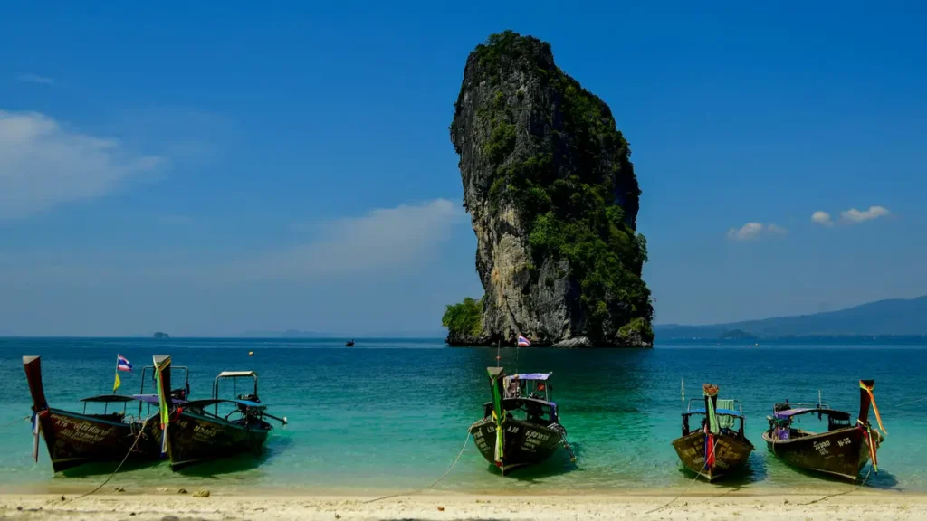 Longtail boats at a limestone island in southern Thailand