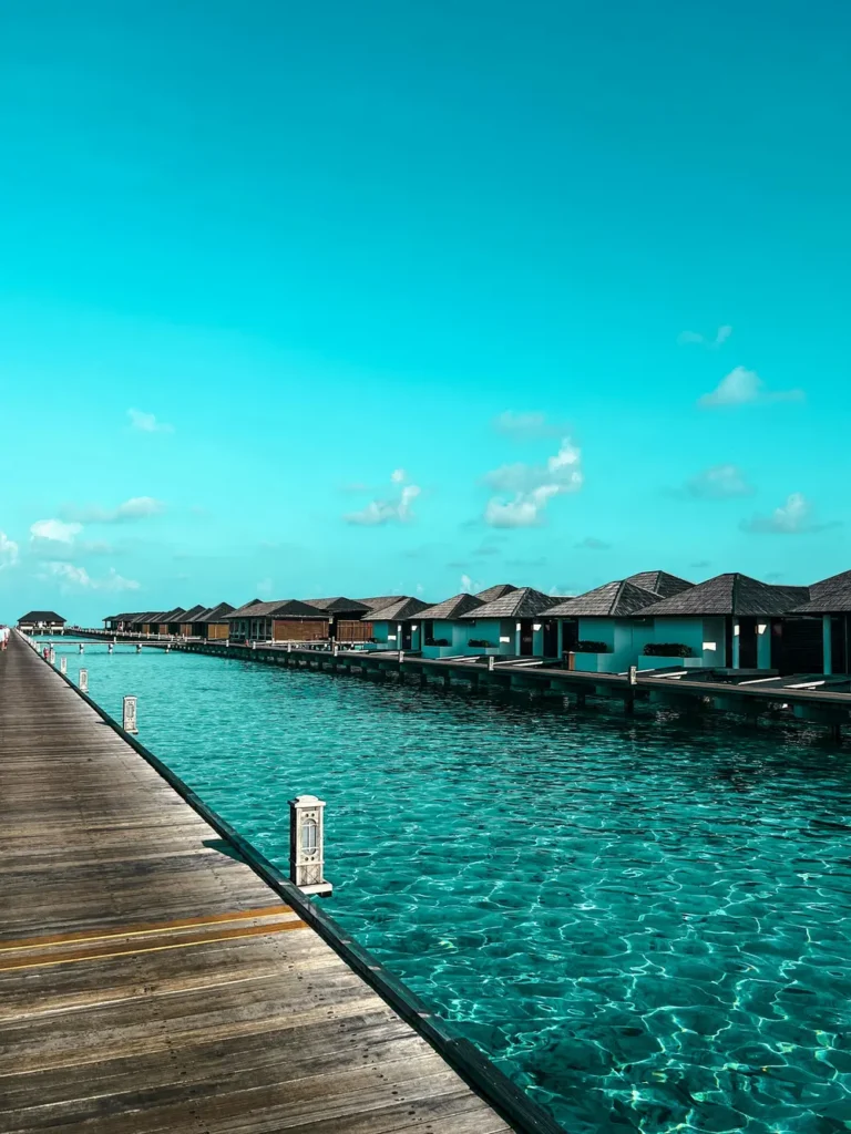 Overwater bungalows along a wooden jetty in the Maldives